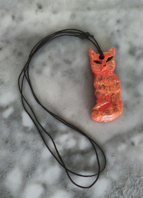 fabric and metal cat amulet|Cat amulet .